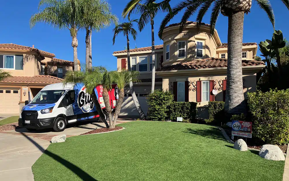My Guy truck parked in front of residential home.